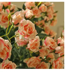 Focus on the delicate details of artificial peach roses, ideal for home floral arrangement decor.