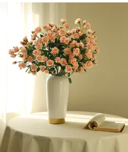 Artificial rose flower arrangement detail view, elegant bubble roses in ceramic vase for home decor.