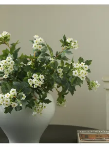 Artificial snowball flower bouquet with white ceramic vase, Nordic minimalist home decor detail.
