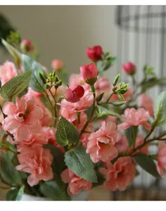 Artificial camellia bouquet silk flowers detail shot for home dining table decor.