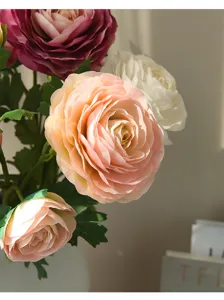 Detailed close-up of artificial ranunculus flowers bouquet for chic home decor and interior styling.