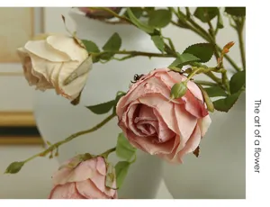 Close up detail of vintage artificial English rose flower branch with elegant burnt edges.