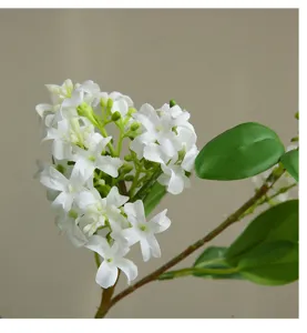 Close-up detail of artificial white jasmine flower branch, modern home interior decoration.