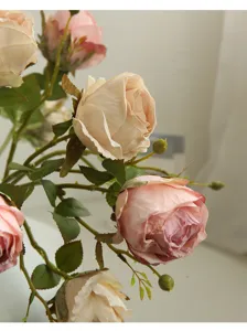 Artificial rose flower detail closeup, vintage retro style faux floral home decor.