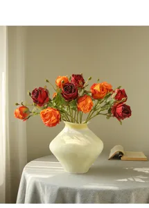Detailed view of vintage artificial rose bouquet in ceramic vase, cozy home decor setup.