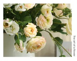 Detailed closeup of artificial peony rose flowers arrangement in a white vase for home decor.