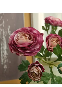 Close-up detail of 4-head artificial ranunculus flower in pink purple for home decor display.