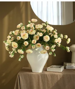 Artificial rose peony flower arrangement in white ceramic vase for elegant home decor.