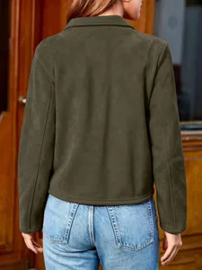 Detail view of a stylish dark green suede jacket featuring a classic lapel and long sleeves.