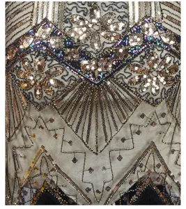 1920s vintage flapper dress sequin beadwork close up detail art deco gold elegant party gown