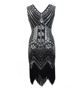 Close-up of black 1920s vintage sequin beaded V-neck dress with lower fringe details.