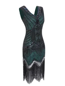 Detailed close-up of 1920s vintage flapper dress featuring black sequins, intricate beading and fringe.