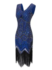 Close-up of the vintage 1920s sequin beaded fabric and elegant black fringe detail on dress.