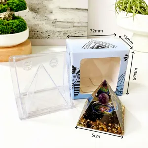Close-up detail of the crystal orgonite pyramid ornament with clear case and Egyptian box.