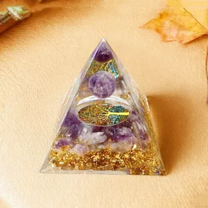 Crystal pyramid ornament detail shot, featuring amethyst chips, gold foil and tree of life.