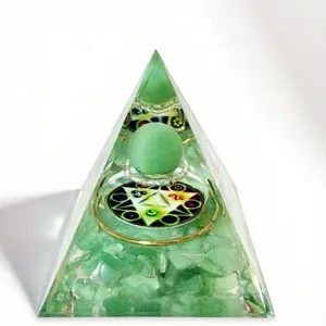 Close up view of green aventurine crystal orgone pyramid detail, resin energy pyramid craft.