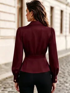 Burgundy long sleeve blouse back view showing elegant waist cinching design detail.