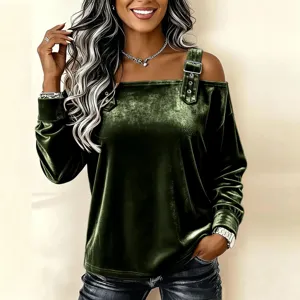 Dark green velvet off-the-shoulder long sleeve top detail showing elegant buckle strap design.
