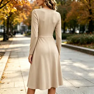 Back view of a solid color long-sleeve midi dress featuring a stylish waist pleat design.