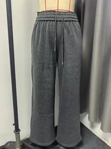 Dark grey fleece lined wide leg sweatpants with elastic drawstring waist for winter comfort.