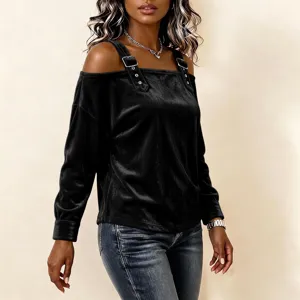 Detailed view of the black velvet off-the-shoulder long sleeve top with stylish strap buckles.