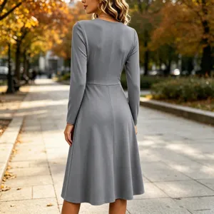 Solid grey long sleeve midi dress featuring V-neck and waist pleats detail.