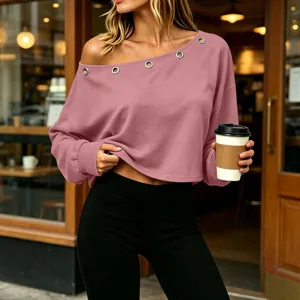 Womens casual off-shoulder long sleeve top with stylish metal eyelet detail. Detail view.