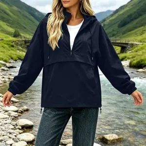 Detail view of the dark blue women's hooded waterproof windbreaker jacket for outdoor casual wear.