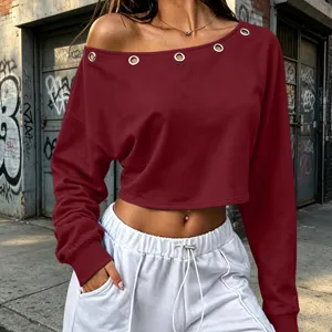 Detail view of wine red off-shoulder long sleeve crop top with metal grommets streetwear.