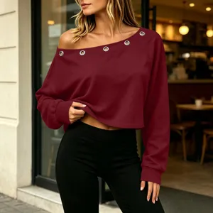 Burgundy off-shoulder top featuring metal eyelet details and long sleeves for women.