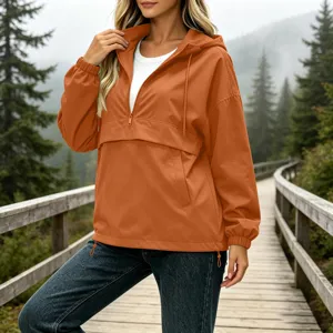 Discover this stylish orange quarter-zip anorak jacket for women, perfect for outdoor adventures.