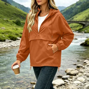 Women outdoor waterproof anorak jacket, hooded half zip windbreaker with pockets orange.