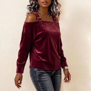 Burgundy velvet off-the-shoulder long sleeve top featuring strap and buckle details.