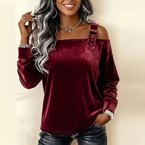 Wine red velvet off-the-shoulder long sleeve top detail with unique buckle strap design.