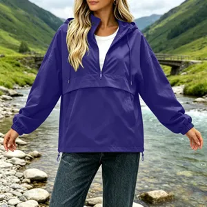 Detail view of the purple half-zip hooded windbreaker jacket featuring waterproof outdoor fabric.