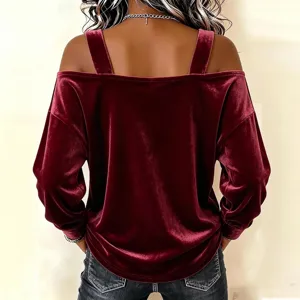Back view detail of women velvet off shoulder long sleeve top in dark red color elegant texture.