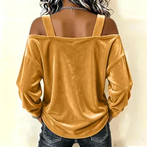 Detail view of women's velvet off shoulder long sleeve top with straps in golden color.