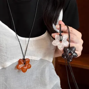 Korean simple flower long necklace detail shot, chic hollow petal pendant sweater chain accessory.