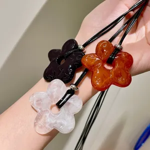 Korean minimalist floral long necklace with chic hollow flower pendant, stylish sweater chain.