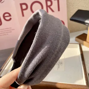 Grey knitted wide headband detail, cozy texture for autumn and winter daily hair styling.