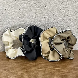 French vintage satin hair scrunchies set with chic black and white braided edge detail.