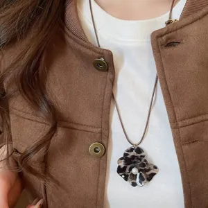 Leopard print pearl flower pendant necklace, unique knit rope sweater chain detail view