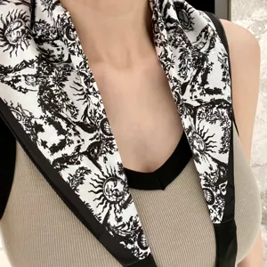 Black and white silk triangle scarf with sun print fashion neck accessory for women.