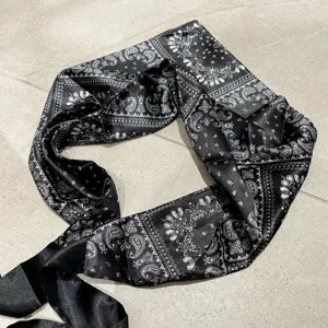 Classic black and white paisley silk-like triangular scarf, versatile waist belt and styling accessory.