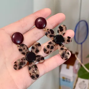 Chic leopard print flower earrings with unique design, elegant and eye-catching drop jewelry.