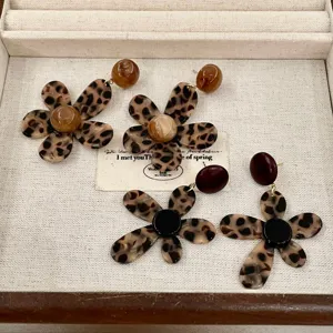 Detailed view of leopard print flower resin earrings, showcasing unique floral design and texture.