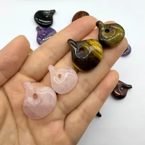 Detail view of natural stone teardrop crystal pendants, polished gemstones for DIY handmade jewelry.