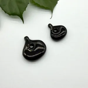 Detailed close-up of black spiral teardrop pendant for DIY handmade necklace jewelry.