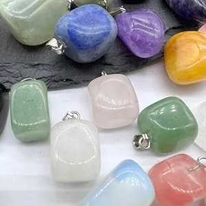 Close-up detail of assorted natural crystal stone square pendant charms for jewelry making