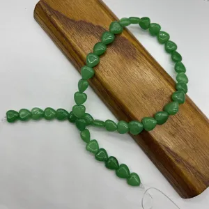 Green natural stone heart loose beads detail view for DIY jewelry making and craft accessories.